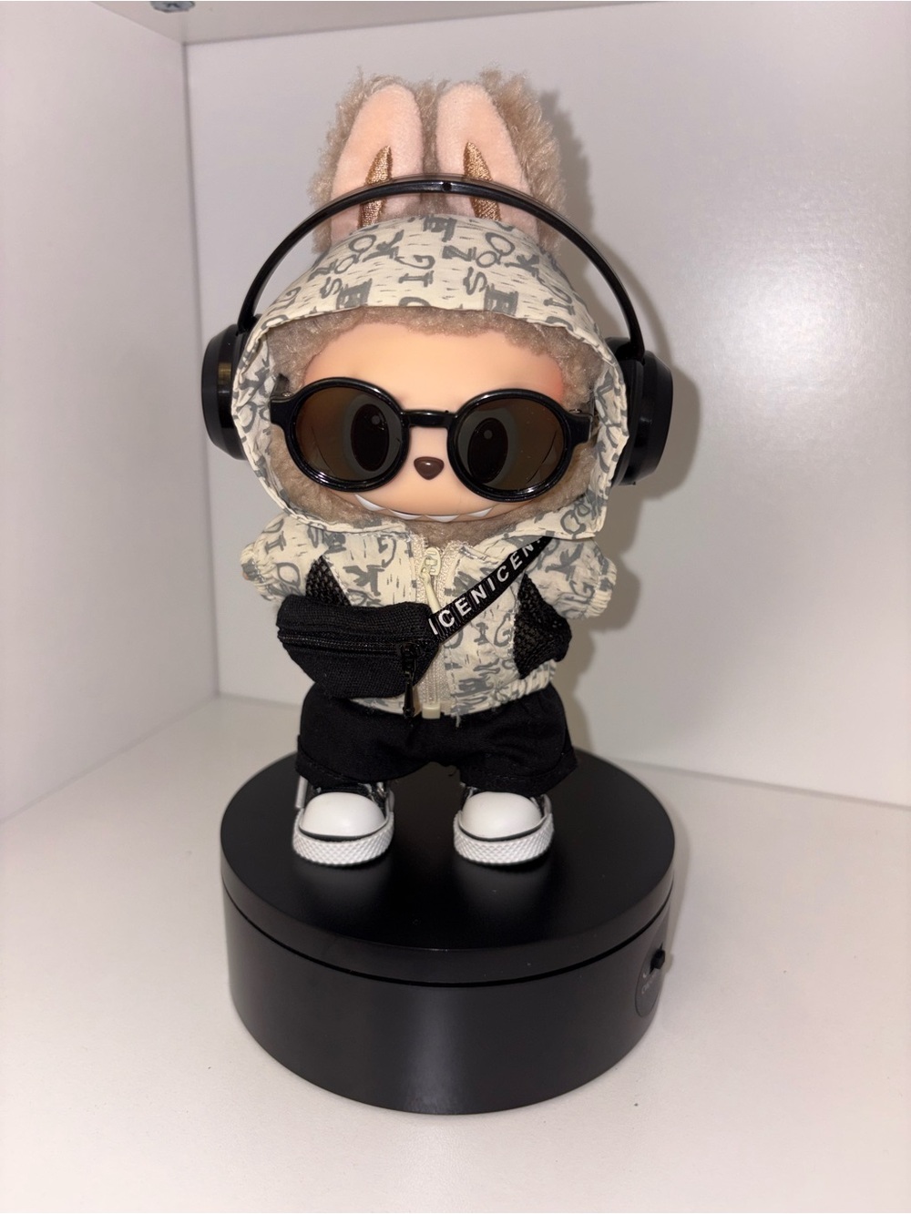 Beige Graphic Hoodie and Black Accessories